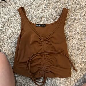 Size xs burnt orange shein tank with stretchy tie.